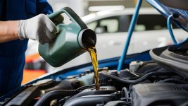 person-is-putting-oil-into-car-that-is-being-worked_1040470-28215.jpg person-is-putting-oil-into-car-that-is-being-worked_1040470-28215.jpg