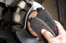 auto-mechanics-replace-worn-brake-pads-maintain-car-braking-system-car-maintenance-concept_414...jpg