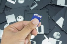 hand-holding-sd-card_35892-147.jpg