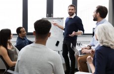 business-team-discussing-their-ideas-while-working-office-min-1536x1003.jpg