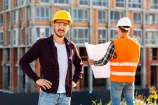 medium-shot-portrait-smiling-architect-looking-camera_23-2148233752.jpg