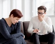 front-view-psychologist-consulting-patient_23-2148567367.jpg